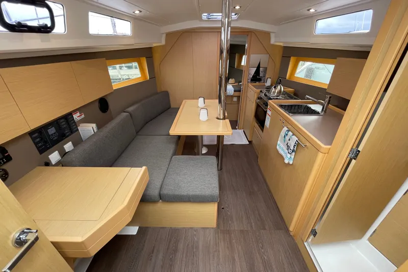Slide: The Image of Interior of 2016 Beneteau Oceanis 35 sailboat, featuring modern kitchen and cozy seating area. - 22