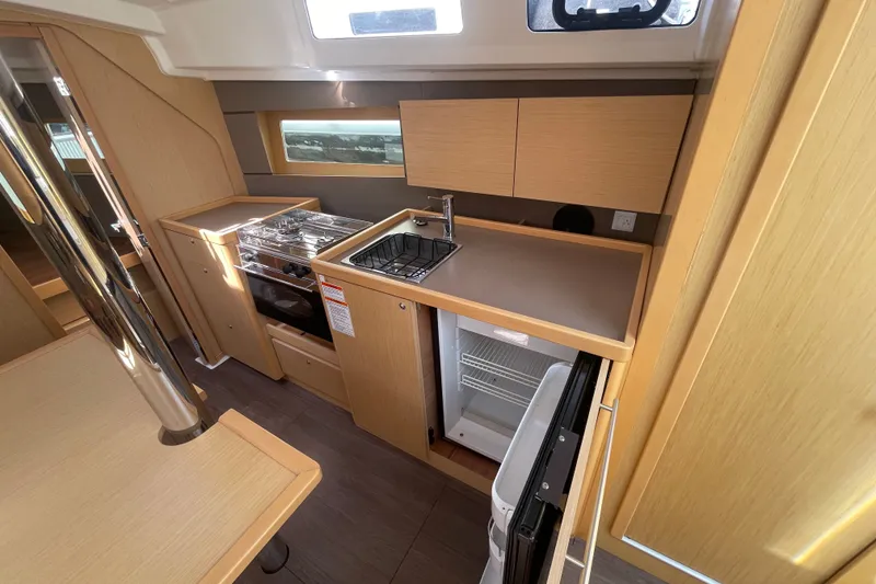 Slide: The Image of Modern kitchen interior of 2016 Beneteau Oceanis 35 yacht with stove, sink, and fridge. - 28