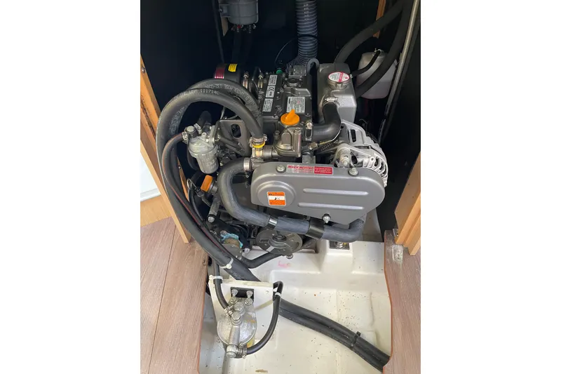 Slide: The Image of Engine compartment of a 2016 Beneteau Oceanis 35 sailboat, showcasing detailed mechanical components. - 45