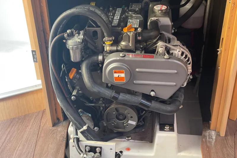 Slide: The Image of Engine compartment of a 2016 Beneteau Oceanis 35 sailboat, showcasing detailed mechanical components. - 46