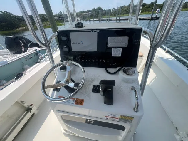 Slide: The Image of The image shows the helm of a 2018 Parker 2100 Deep Vee boat with a Garmin navigation system. - 5