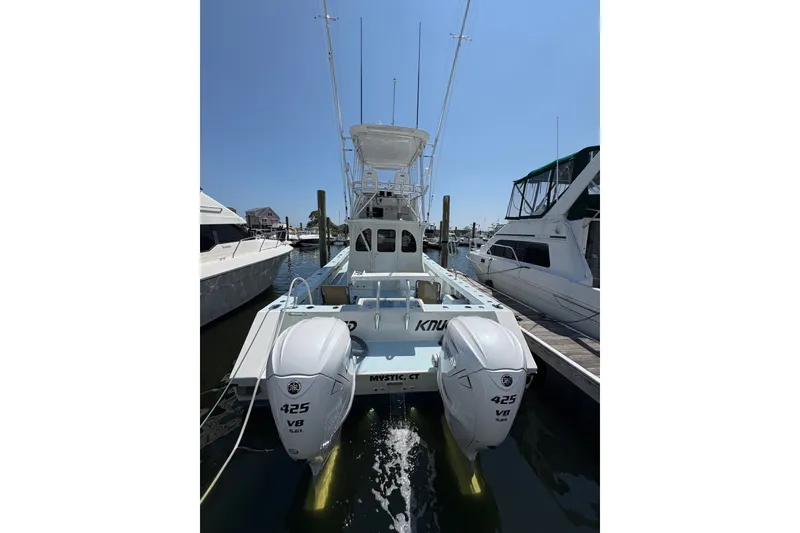 Slide: The Image of 2023 Millenium 37 Walk Around Fly Bridge Sportfish docked with dual 425 V8 engines. - 43