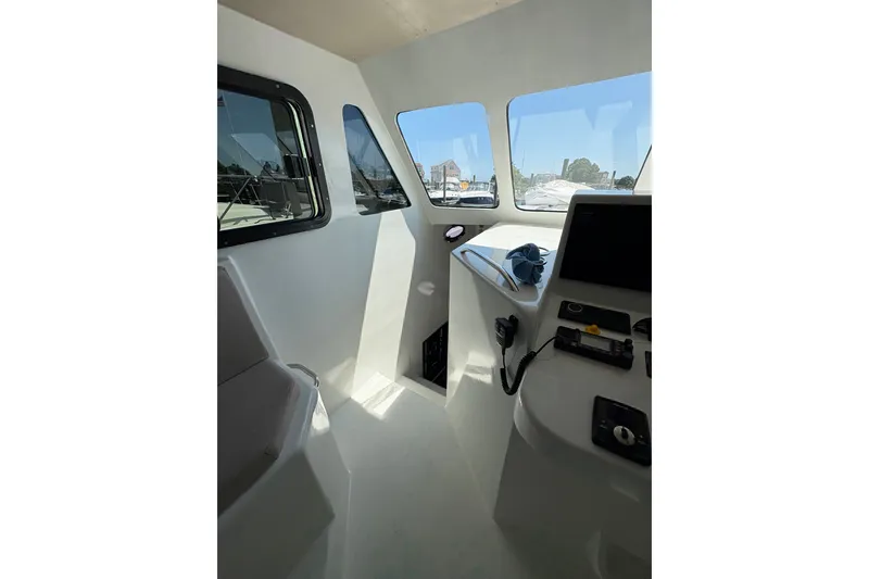 Slide: The Image of Interior view of 2023 Millenium 37 Walk Around Fly Bridge Sportfish boat cockpit. - 51