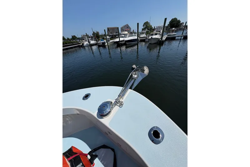 Slide: The Image of 2023 Millenium 37 Walk Around Fly Bridge Sportfish at marina, showcasing bow and anchor. - 45