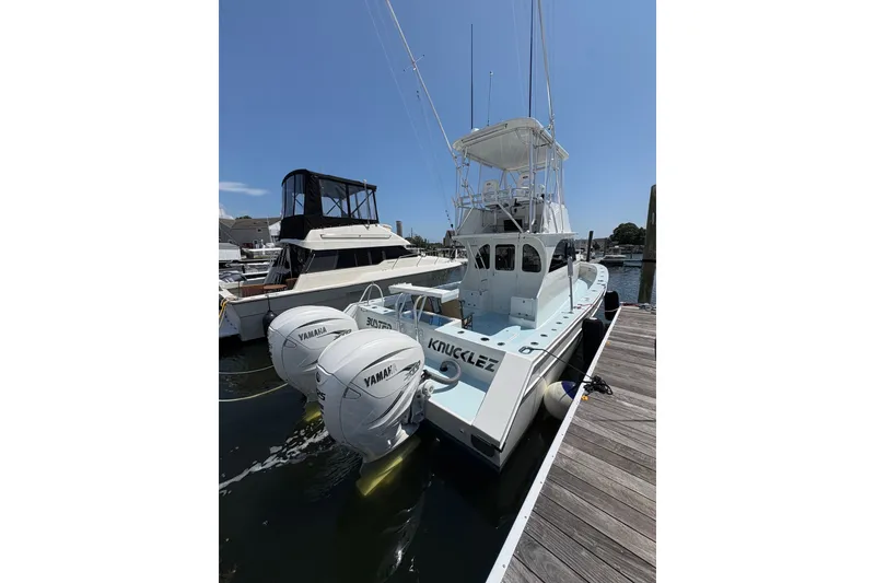 Slide: The Image of 2023 Millenium 37 Walk Around Fly Bridge Sportfish docked with Yamaha engines. - 21