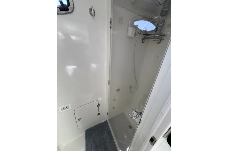 Slide: The Image of Shower area in 2023 Millenium 37 Walk Around Fly Bridge Sportfish boat. - 39