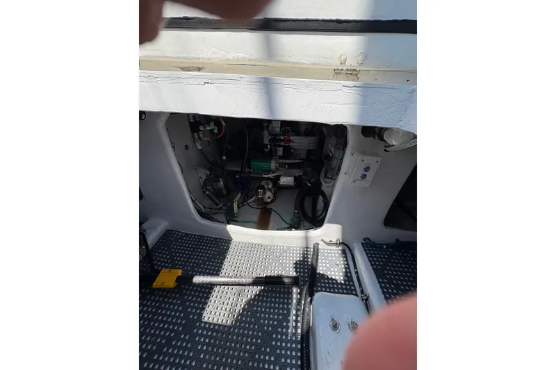 Slide: The Image of Engine compartment of 2023 Millenium 37 Walk Around Fly Bridge Sportfish boat. - 28