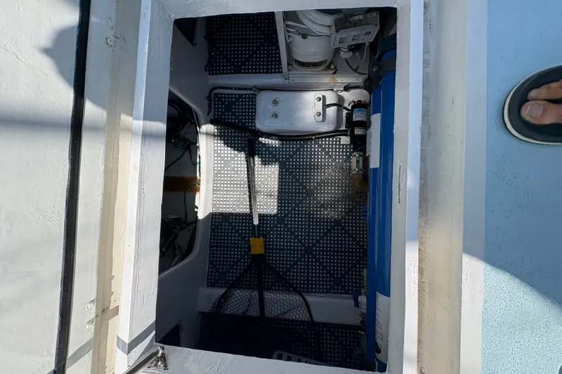 Slide: The Image of Engine compartment of 2023 Millenium 37 Walk Around Fly Bridge Sportfish boat. - 26