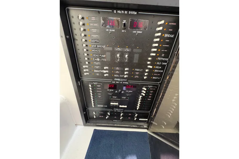 Slide: The Image of Electrical control panel on 2023 Millenium 37 Walk Around Fly Bridge Sportfish boat. - 20