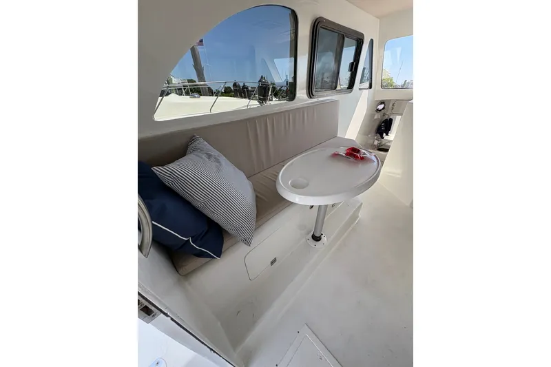 Slide: The Image of Interior of 2023 Millenium 37 Walk Around Fly Bridge Sportfish with seating and table. - 17