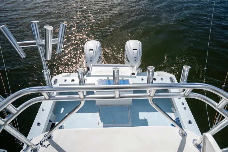 Slide: The Image of 2023 Millennium Marine 37 Walk Around Fly Bridge Sportfish, rear view with dual engines. - 78