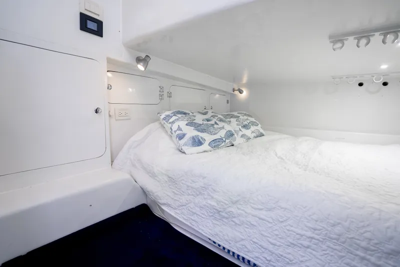 Slide: The Image of Cozy cabin interior of 2023 Millennium Marine 37 Walk Around Fly Bridge Sportfish. - 96