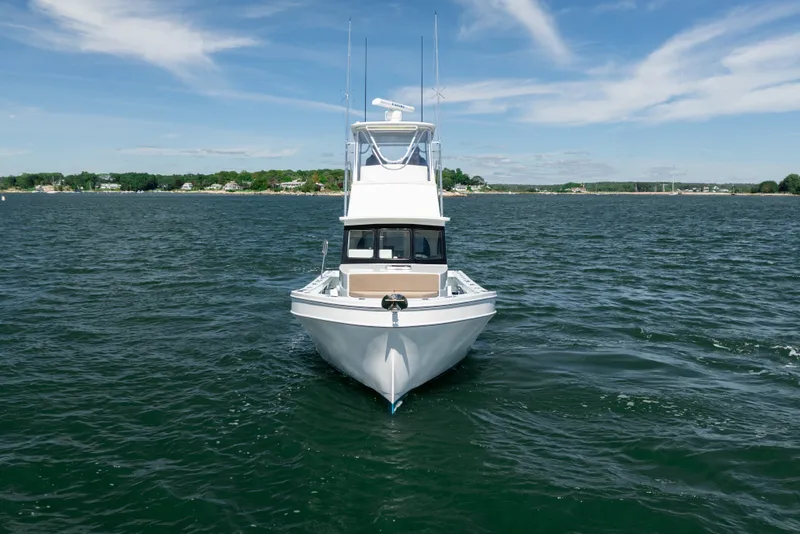 Slide: The Image of 2023 Millennium Marine 37 Walk Around Fly Bridge Sportfish on open water. - 63