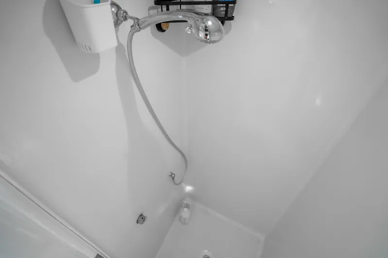 Slide: The Image of Shower area in 2023 Millennium Marine 37 Walk Around Fly Bridge Sportfish boat. - 102