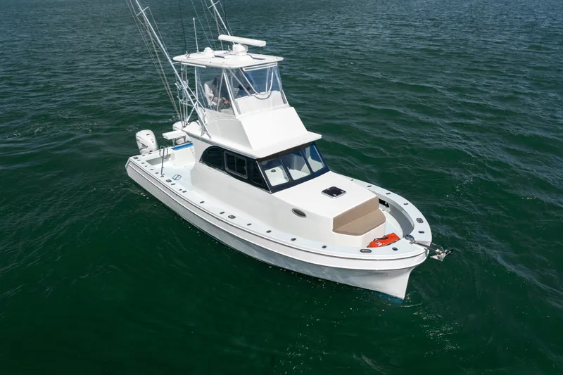Slide: The Image of 2023 Millennium Marine 37 Walk Around Fly Bridge Sportfish on open water. - 69