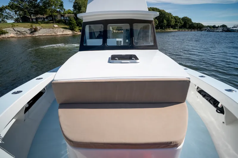 Slide: The Image of 2023 Millennium Marine 37 Walk Around Fly Bridge Sportfish on serene waterway. - 71