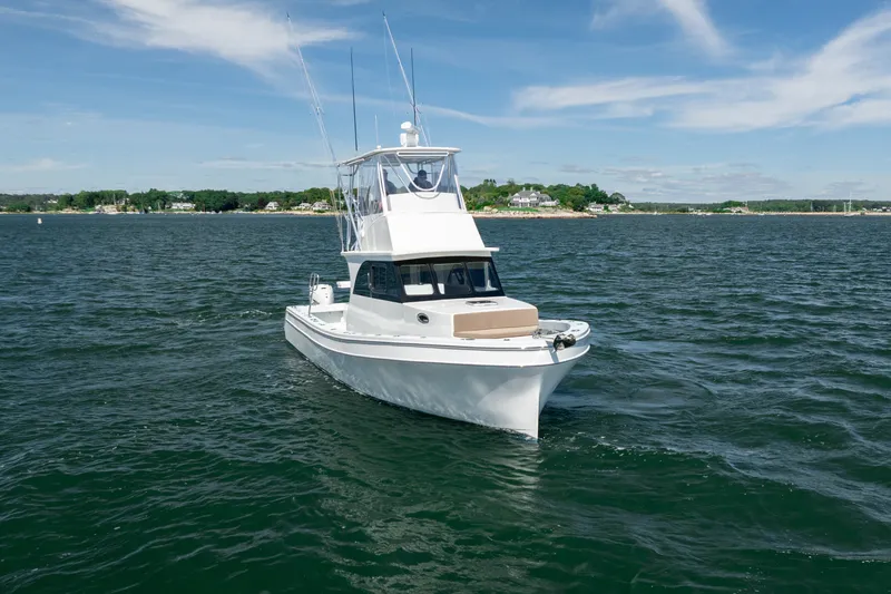 Slide: The Image of 2023 Millennium Marine 37 Walk Around Fly Bridge Sportfish on open water. - 62