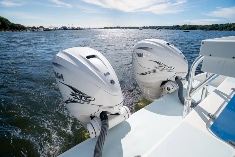 Slide: The Image of Twin Yamaha XTO outboard engines on a 2023 Millennium Marine 37 Walk Around Fly Bridge Sportfish. - 81