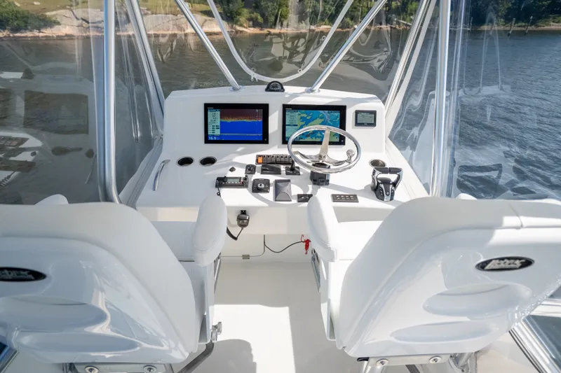 Slide: The Image of 2023 Millennium Marine 37 Walk Around Fly Bridge Sportfish helm with advanced navigation displays. - 74