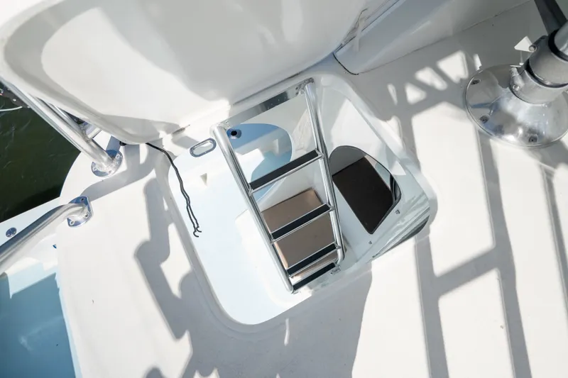 Slide: The Image of Hatch and ladder on 2023 Millennium Marine 37 Walk Around Fly Bridge Sportfish boat. - 76