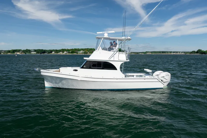 Slide: The Image of 2023 Millennium Marine 37 Walk Around Fly Bridge Sportfish on open water. - 65