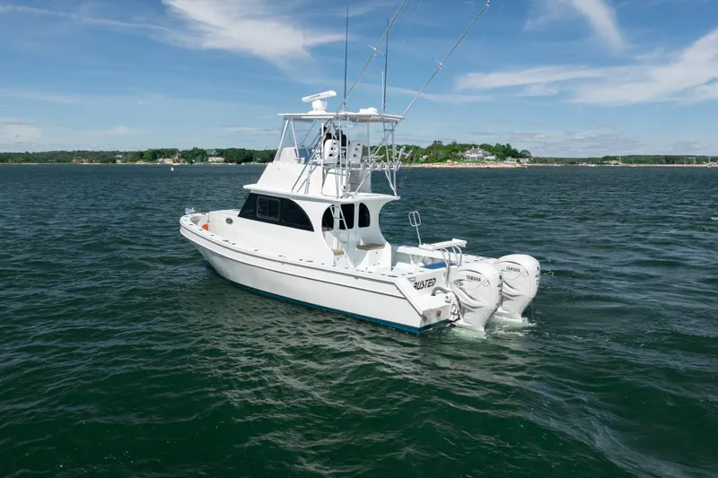 Slide: The Image of 2023 Millennium Marine 37 Walk Around Fly Bridge Sportfish on open water. - 66