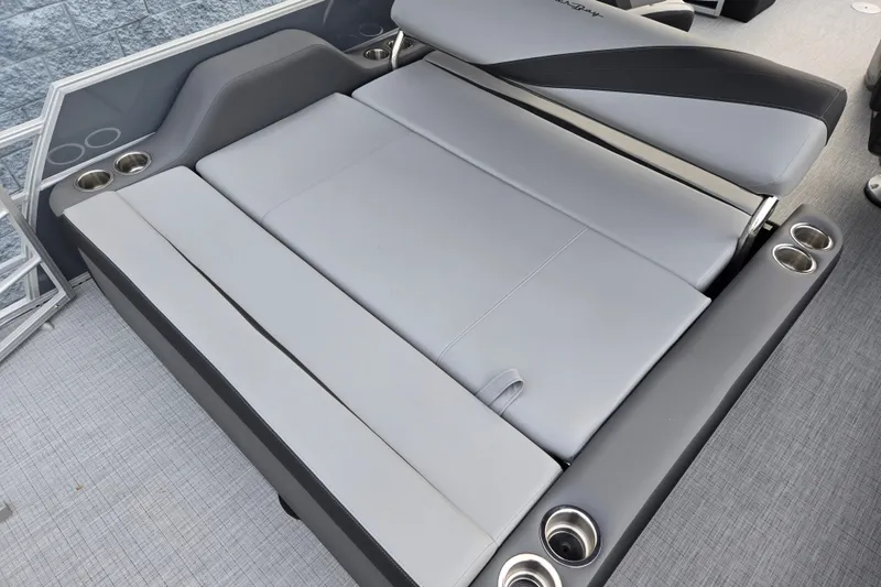 Slide: The Image of The image shows a gray lounging area on a boat with multiple cup holders. - 10