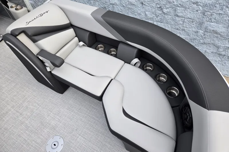 Slide: The Image of The 2027 South Bay SS224UL2.75 features a sleek, cushioned seating area with cup holders. - 5