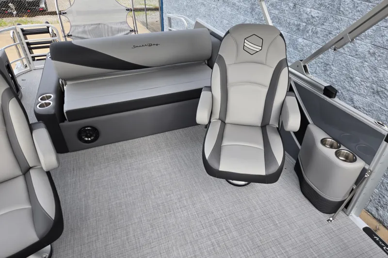 Slide: The Image of The image shows the interior of a 2027 South Bay SS224UL2.75 boat with gray seating. - 6