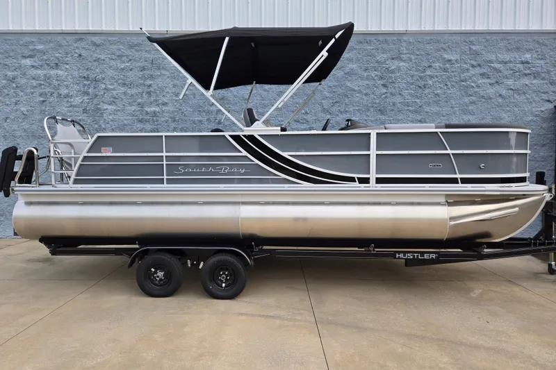 The Image of A modern pontoon boat by South Bay, model SS224UL2.75, year 2027, sits on a trailer. - 1