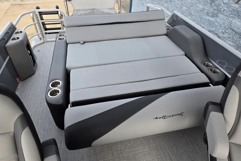 Slide: The Image of The image shows the rear of a 2027 South Bay SS224UL2.75 boat with gray upholstery and cup holders. - 11