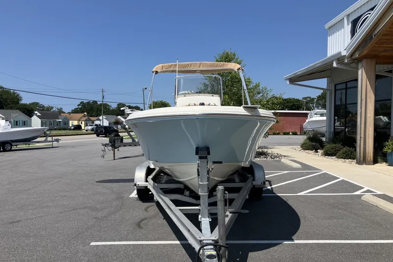 Slide: The Image of 2017 Pioneer 202 Sportfish boat on trailer in parking lot, sunny day. - 4