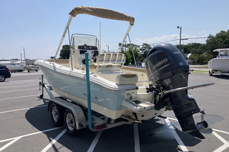 Slide: The Image of 2017 Pioneer 202 Sportfish boat with Yamaha engine on trailer in parking lot. - 7