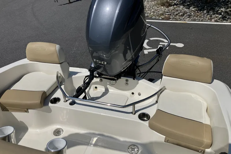 Slide: The Image of 2017 Pioneer 202 Sportfish boat with Yamaha 150 engine and beige seating. - 16