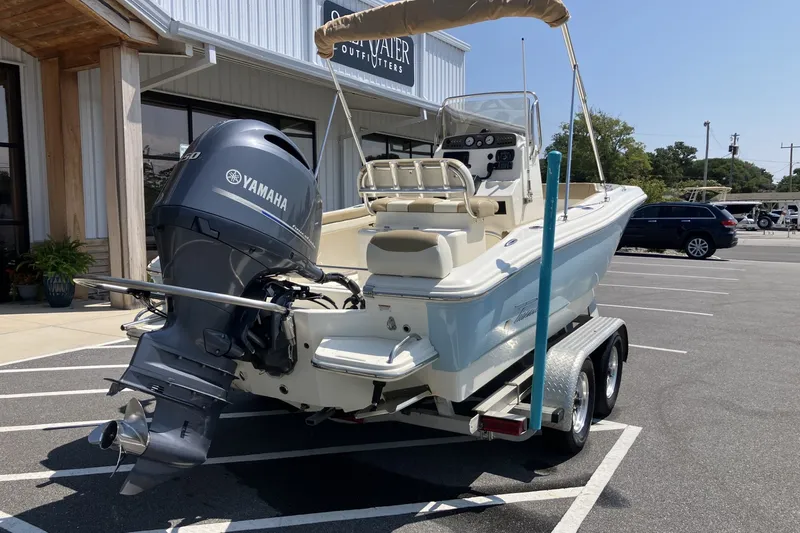 Slide: The Image of 2017 Pioneer 202 Sportfish boat with Yamaha engine on trailer in parking lot. - 5