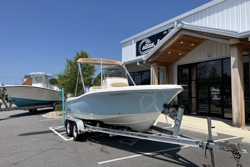 Slide: The Image of 2017 Pioneer 202 Sportfish boat on trailer outside Collins showroom. - 2