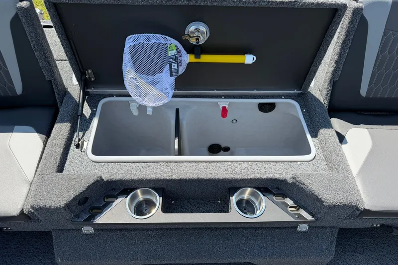 Slide: The Image of Livewell compartment in 2027 Lund 1875 Pro-V boat, featuring cup holders and fishing net. - 7