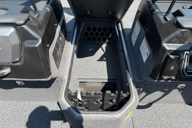 Slide: The Image of 2027 Lund 1875 Pro-V boat interior storage compartment with open lid and organized layout. - 10