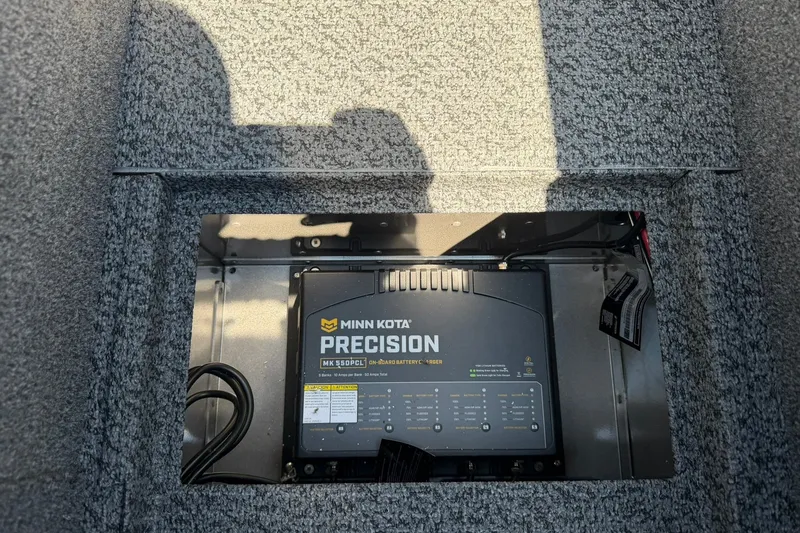 Slide: The Image of Minn Kota Precision battery charger in 2027 Lund 1875 Pro-V boat compartment. - 22