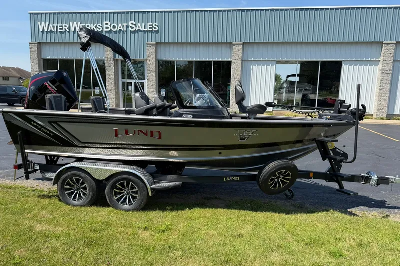 Slide: The Image of 2027 Lund 1875 Pro-V boat on trailer at Water Works Boat Sales dealership. - 1