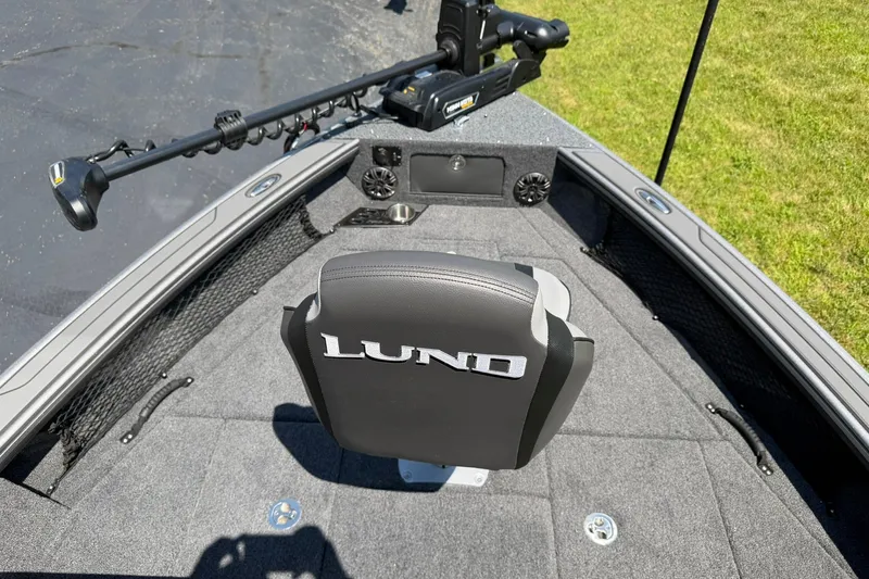 Slide: The Image of 2027 Lund 1875 Pro-V boat interior with branded seat and trolling motor. - 15