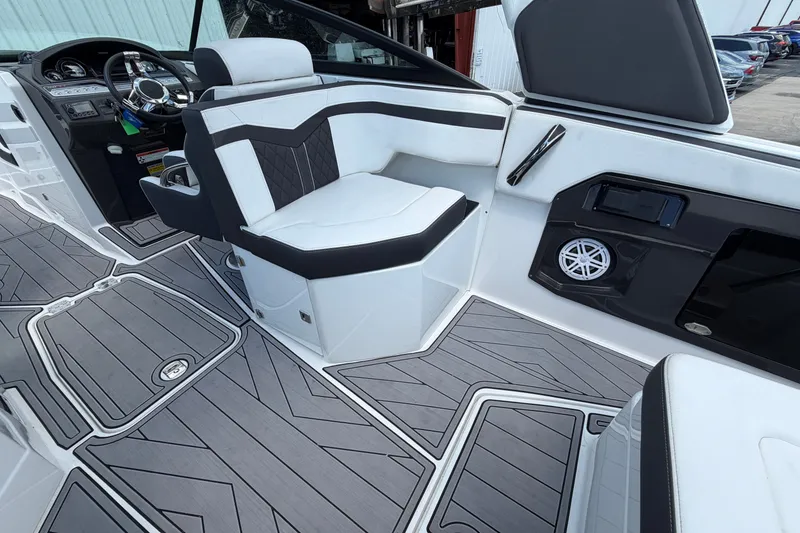 Slide: The Image of 2023 Monterey 258SS Super Sport boat interior with sleek seating and modern dashboard design. - 16