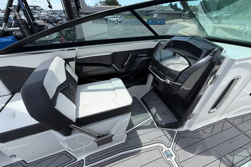 Slide: The Image of 2023 Monterey 258SS Super Sport boat interior with sleek seating and modern dashboard design. - 14