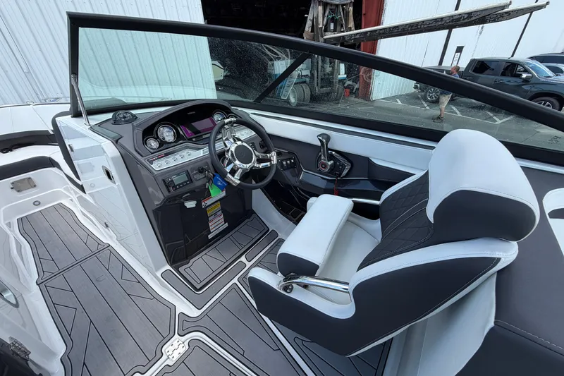 Slide: The Image of 2023 Monterey 258SS Super Sport boat interior with modern dashboard and sleek seating. - 11