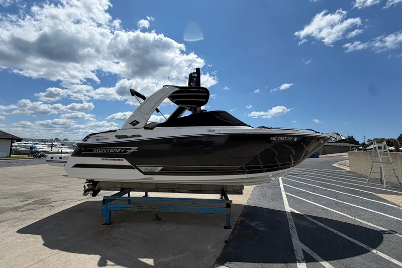 Slide: The Image of 2023 Monterey 258SS Super Sport boat on display under a clear blue sky. - 4