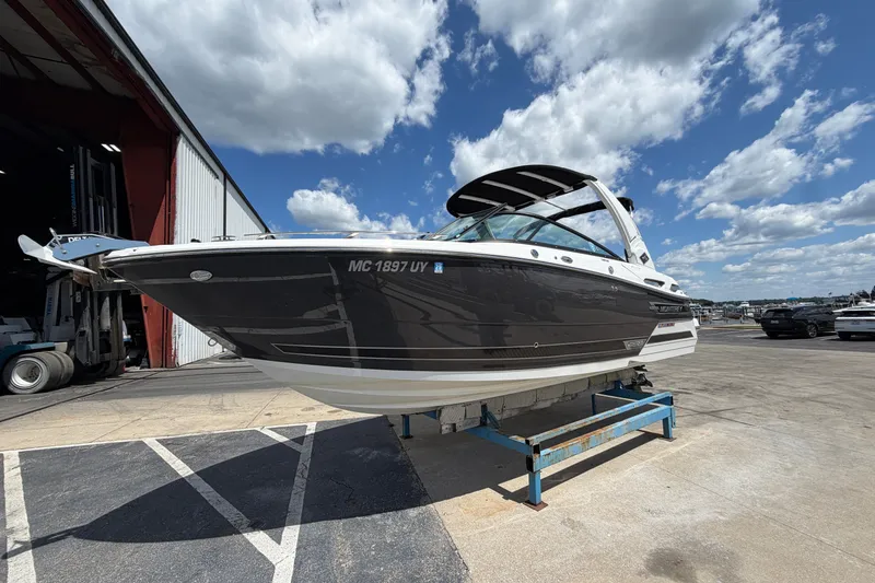 The Image of 2023 Monterey 258SS Super Sport boat on display under a clear blue sky. - 0
