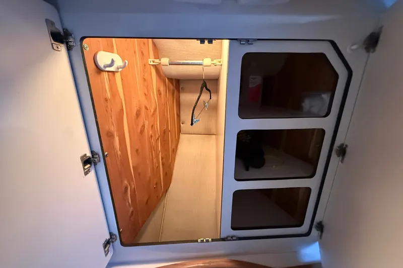 Slide: The Image of Interior storage space of a 1996 Sea Ray 400 Express Cruiser boat. - 39