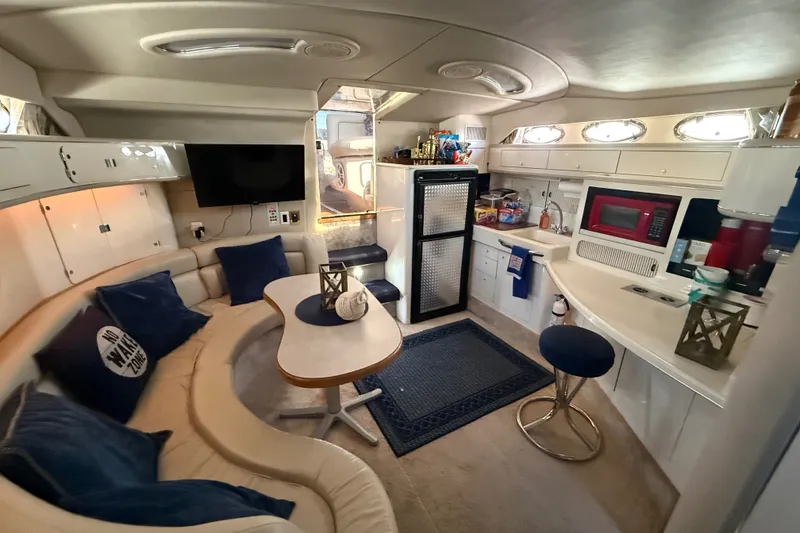 Slide: The Image of Luxurious interior of a 1996 Sea Ray 400 Express Cruiser with modern amenities. - 31