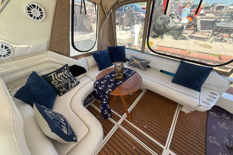 Slide: The Image of Interior of a 1996 Sea Ray 400 Express Cruiser with nautical-themed decor. - 10