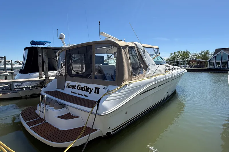 The Image of 1996 Sea Ray 400 Express Cruiser docked, named "Knot Guilty II," at Catawba Island, Ohio. - 0